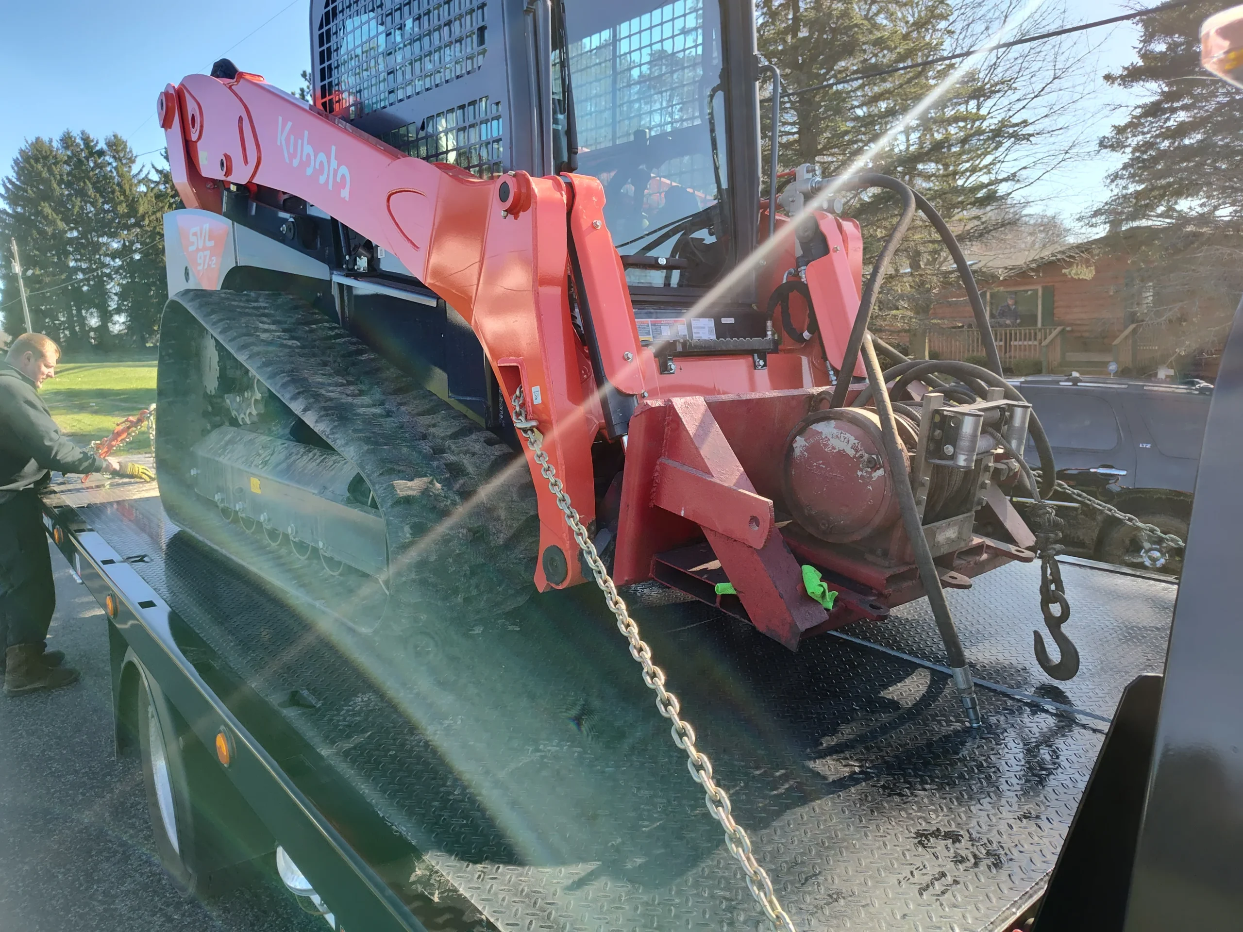 Zielke Towing hauling Kubota loader for brake repair in Benton Harbor, Michigan