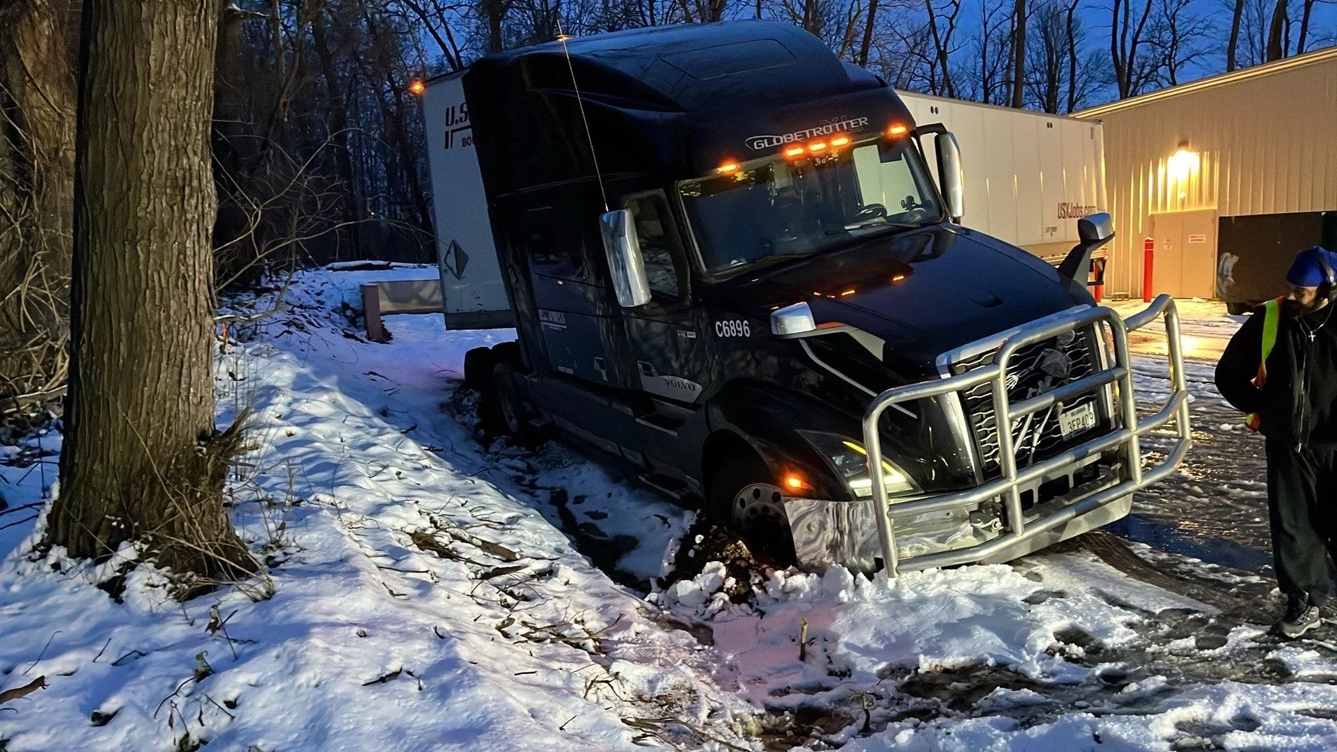 Semi-truck stuck in snow needing battery or climate control service in Benton Harbor