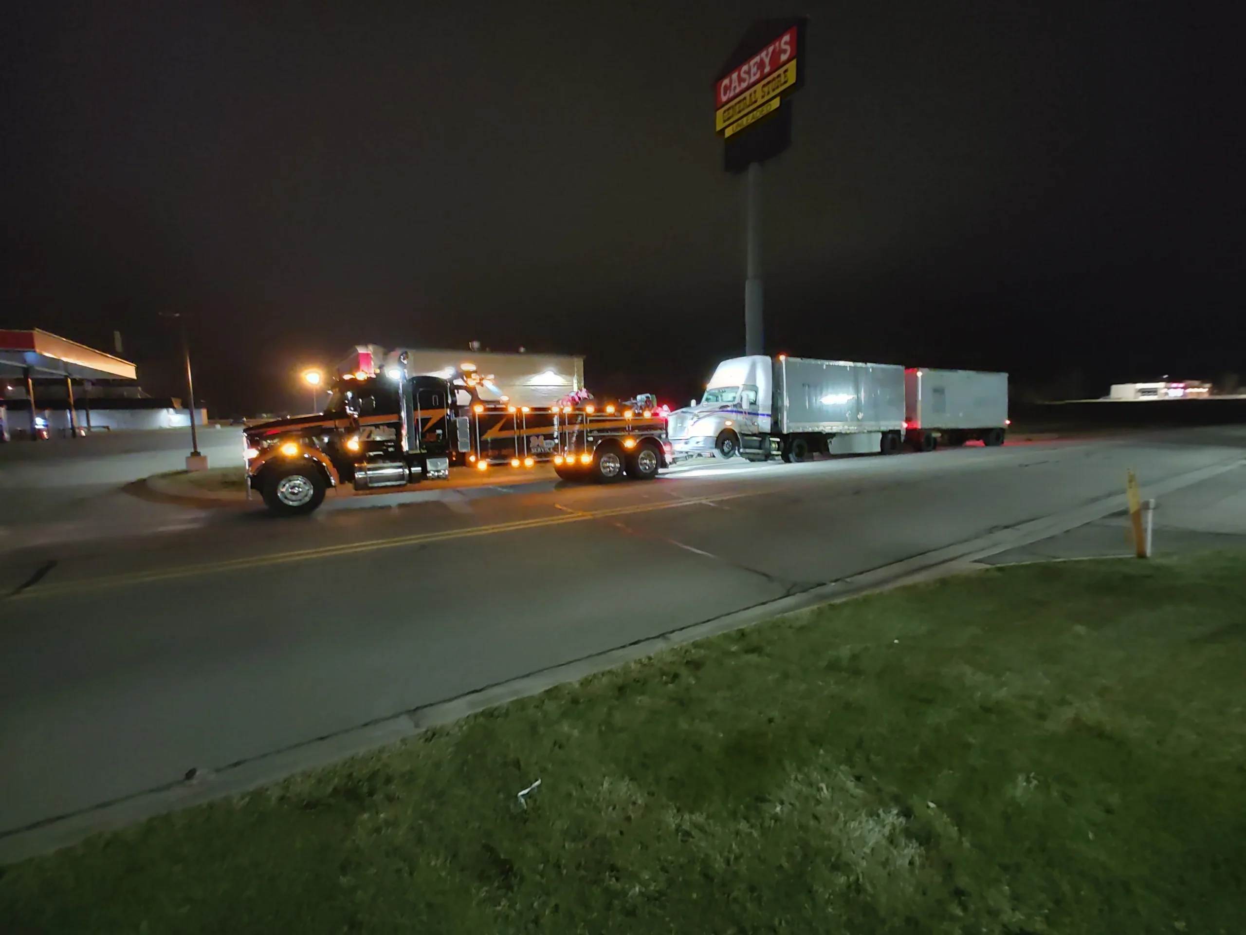 Zielke heavy-duty wrecker towing semi-truck at night near Casey’s in Benton Harbor, MI