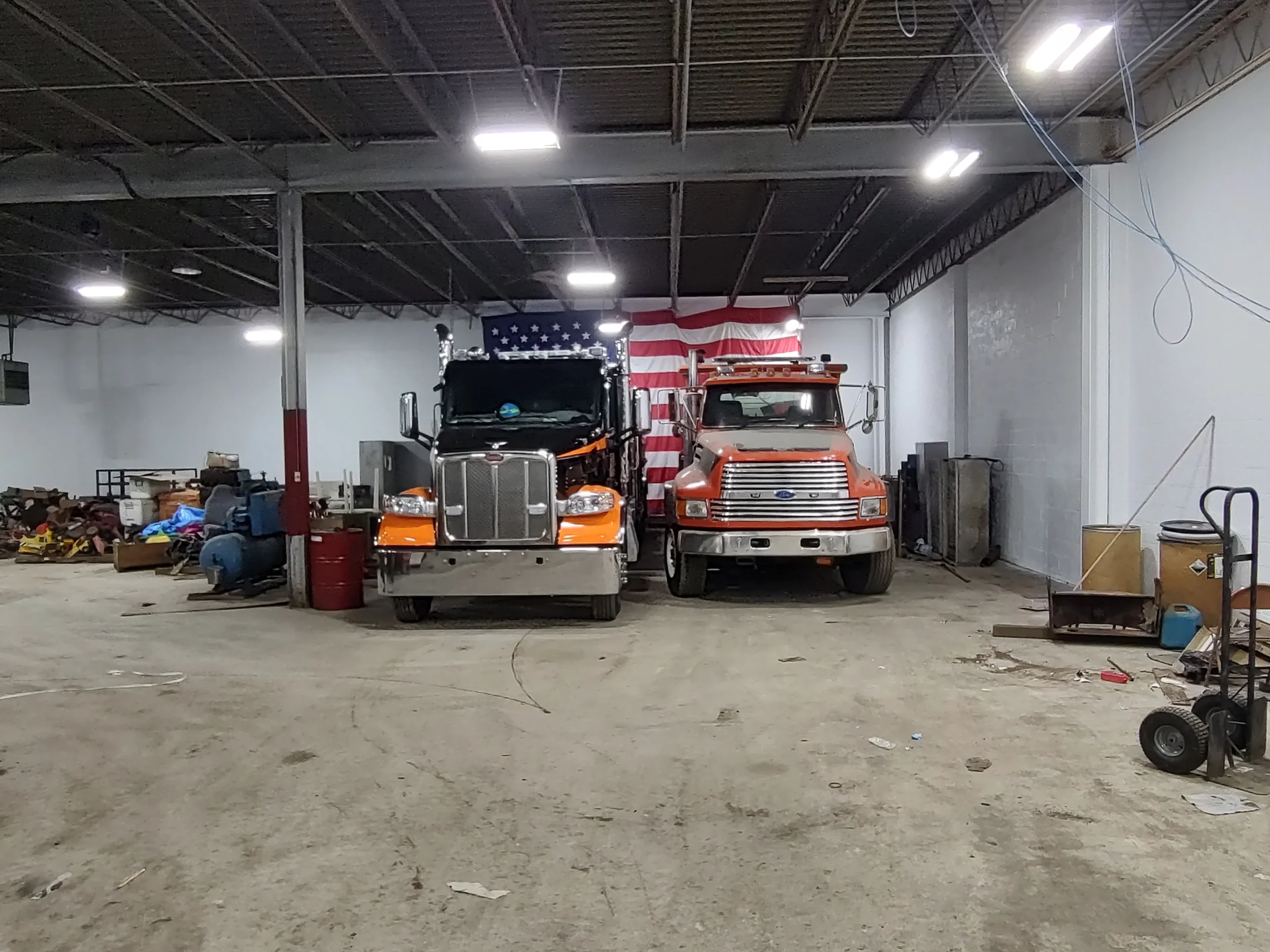 Zielke Towing shop in Benton Harbor with a Peterbilt truck in for tire inspection and service alongside other fleet vehicles