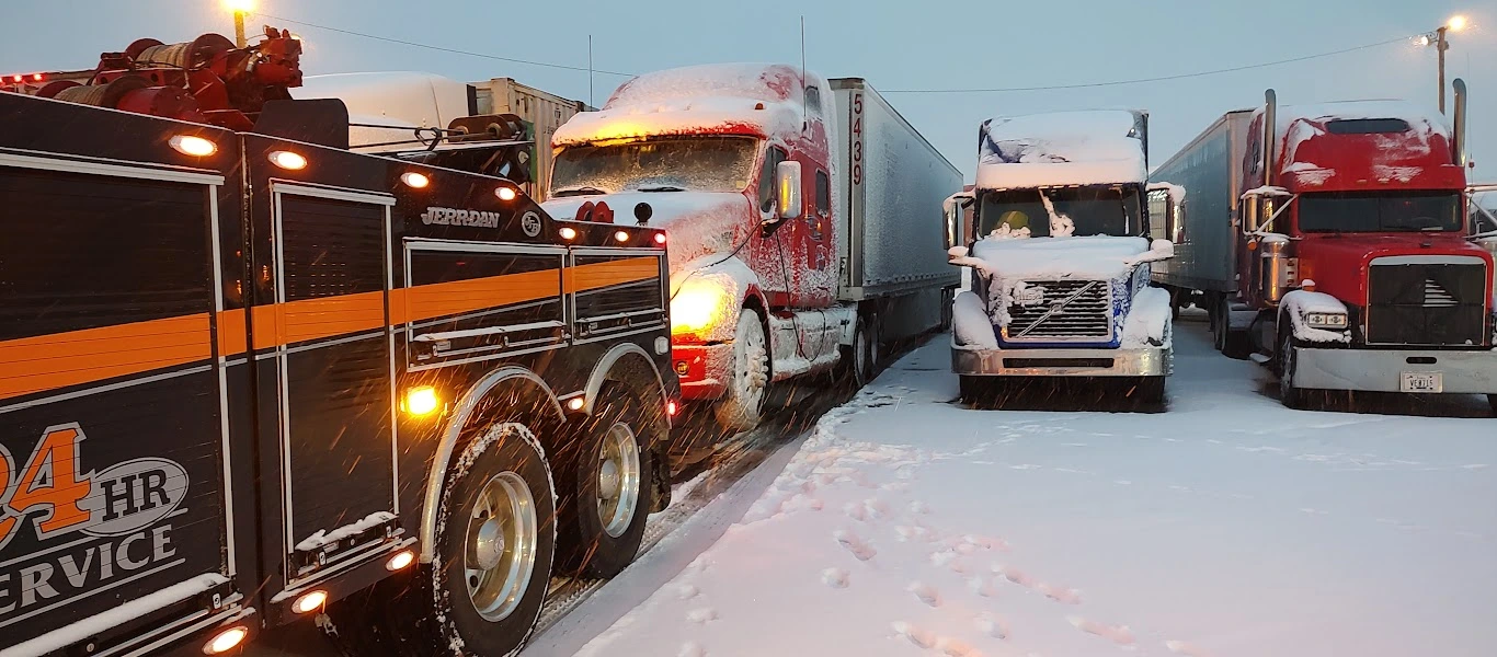 Zielke heavy-duty wrecker towing semi-truck in Benton Harbor snowstorm
