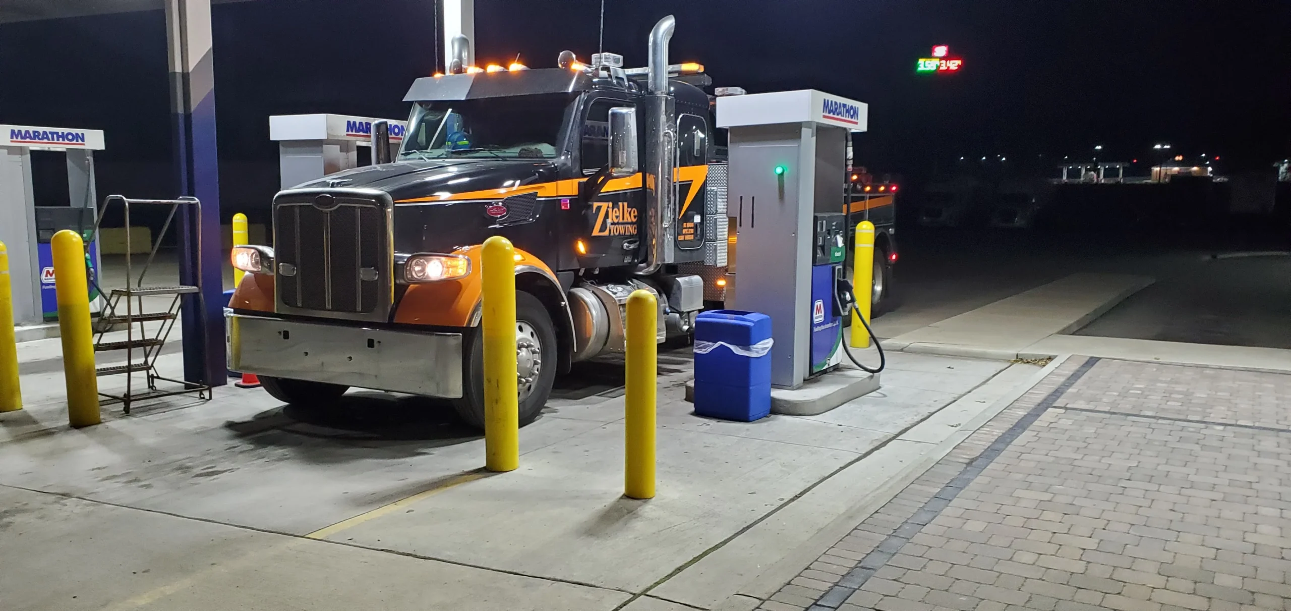 Zielke towing truck parked at Marathon fuel station for roadside response in Benton Harbor, MI