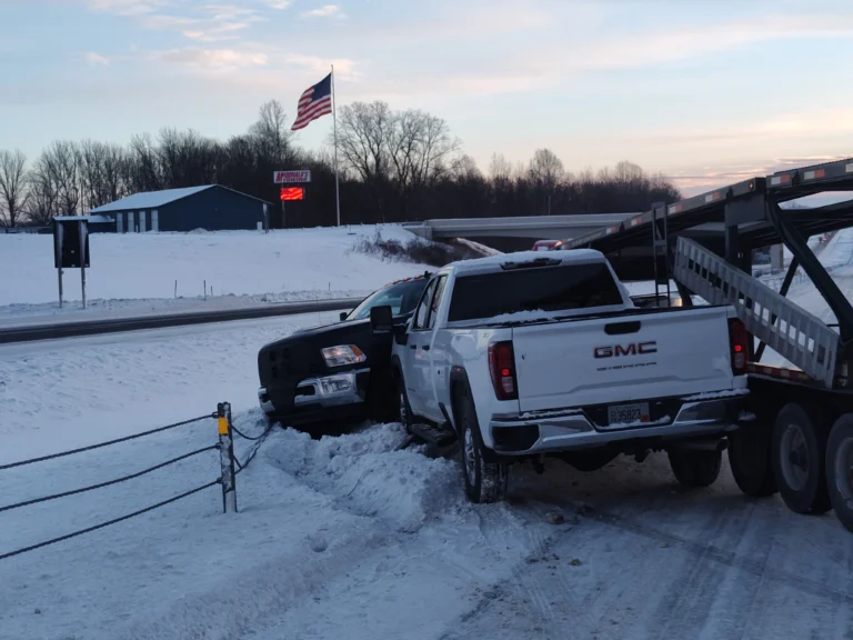 Zielke Towing performing winch out service for trucks stuck in snow near Benton Harbor highway