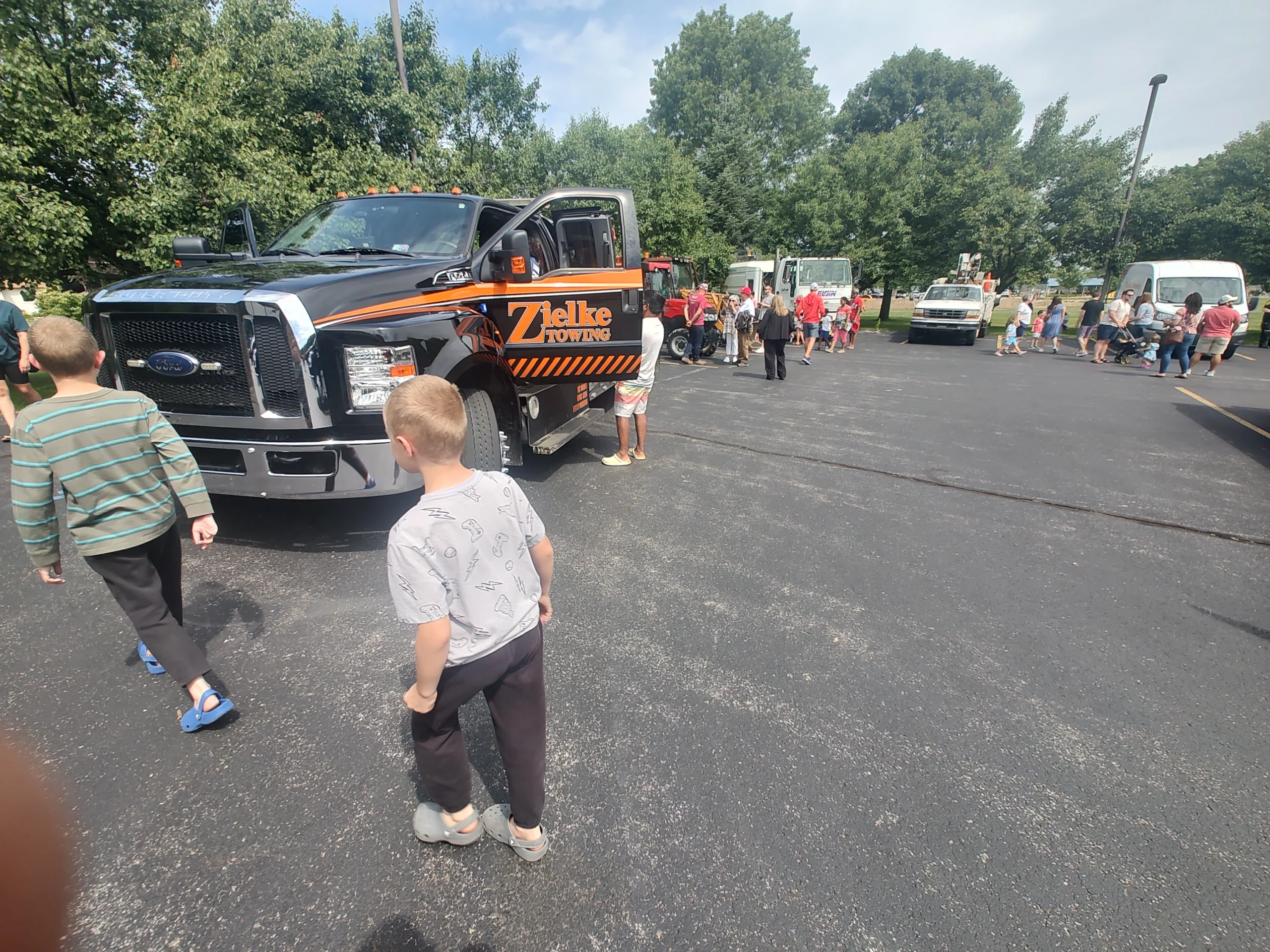 Zielke Towing truck at public event with children and families learning about vehicle safety and drivetrain basics