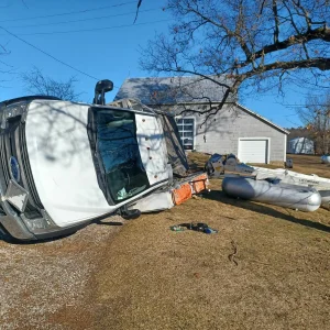 Rolled-over truck and boat during accident recovery in Benton Harbor, MI